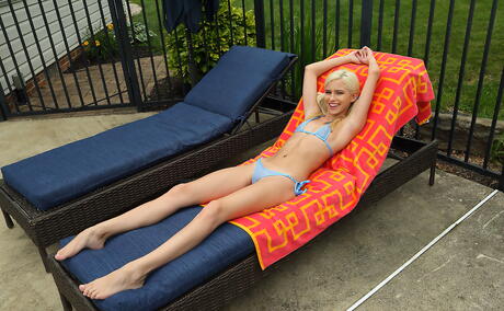 Gracile blond teen Kiara Cole in sexy bikini uncovers tiny tits and jerks off near the pool