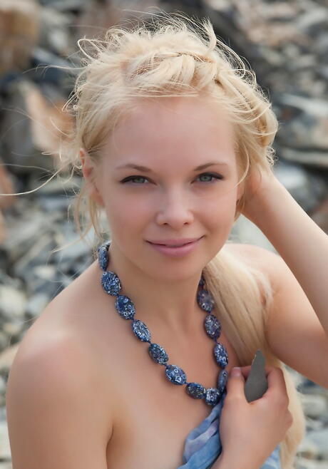 Foxy blonde teen Feeona A baring small tits and sexy butt on the beach